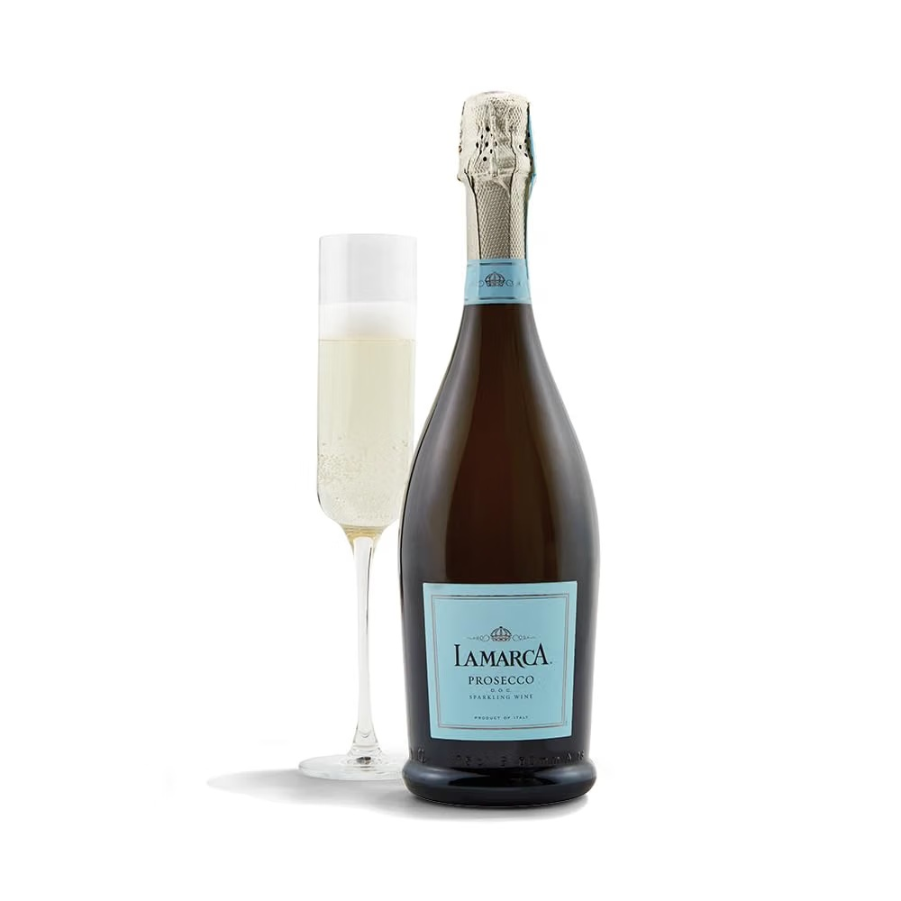 Bottle of La Marca Prosecco beside a filled flute